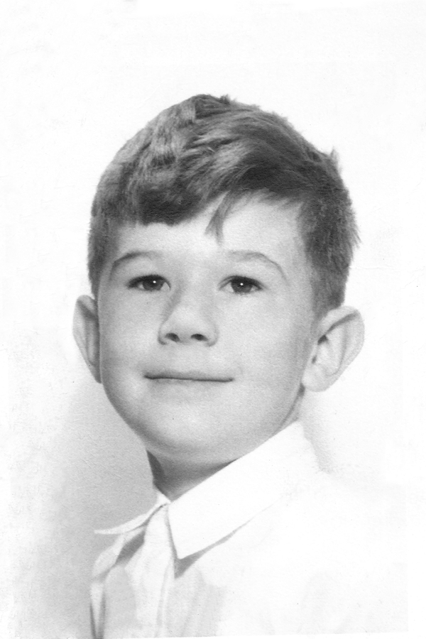 Restored childhood portrait with cracks and damage repaired